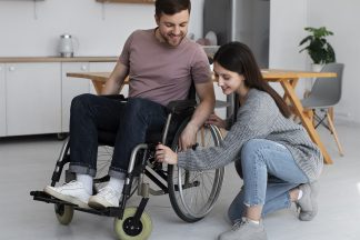 young-adult-helping-disabled-friend
