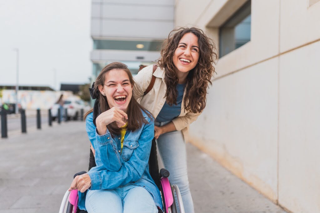 A carer helping a woman get ready at home